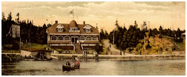 (Image: Seen from Across the Lake, Boaters Paddle a Canoe
 with the Pavilion on a Hill in the Background)