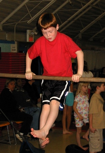 James on the uneven bars