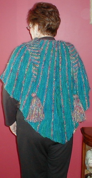 The Radiant Shawl knit in blue mohair and variegated sparkly yarn.